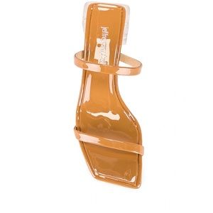 Double strap sandal in nude patent and clear heel.